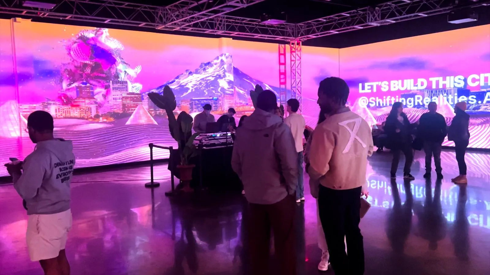 Projection-mapped visuals wrapping the walls of Porsche Studio Portland
